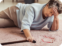 Senior woman with movement impairment. Falls can be common for this condition.