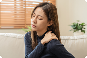 Asian woman with shoulder pain.