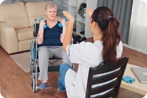 Woman exercising with pt pre-surgical rehab.