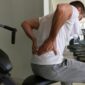 Man with lower back pain while working out.